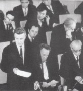 Kristijono Donelaičio 250-ųjų gimimo metinių minėjime: stovi Justinas Marcinkevičius, greta Teofilis Tilvytis, Vincas Mykolaitis-Putinas. 1964 m. vasario 4 d. Antano Sutkaus nuotrauka